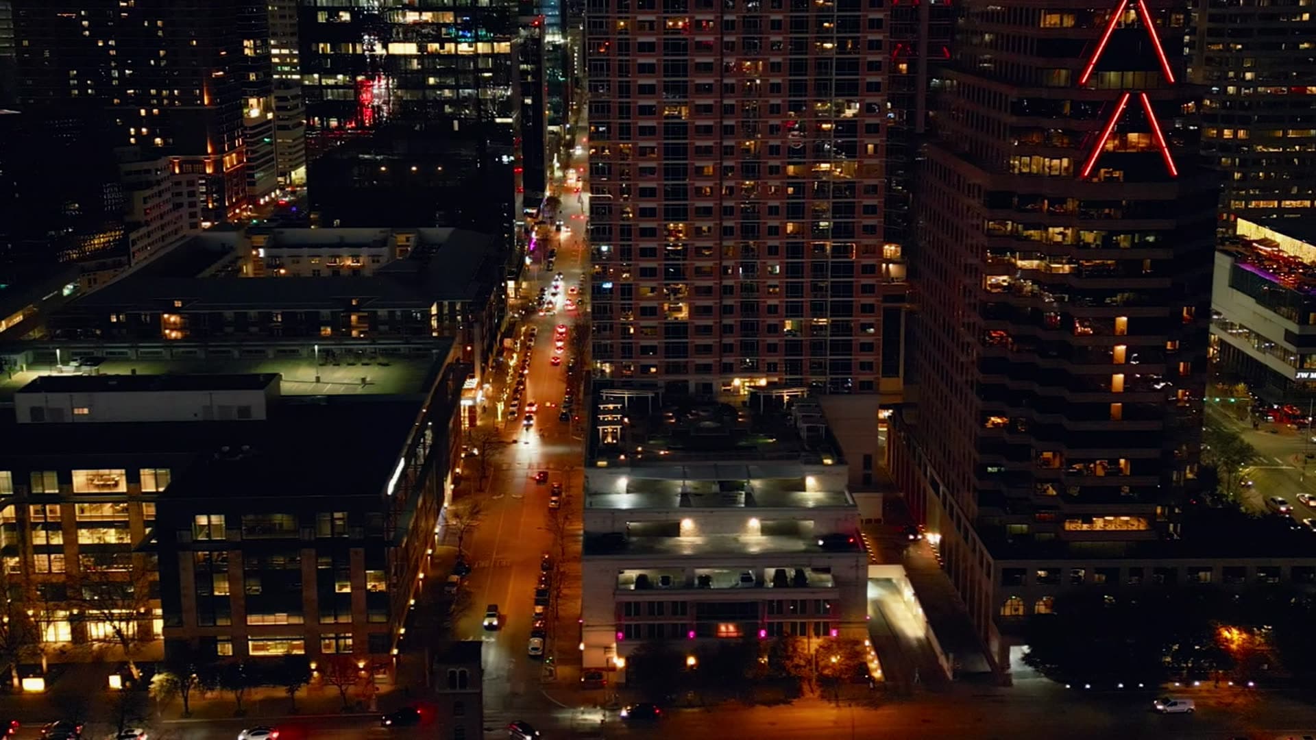 Downtown towers and lit streets at night