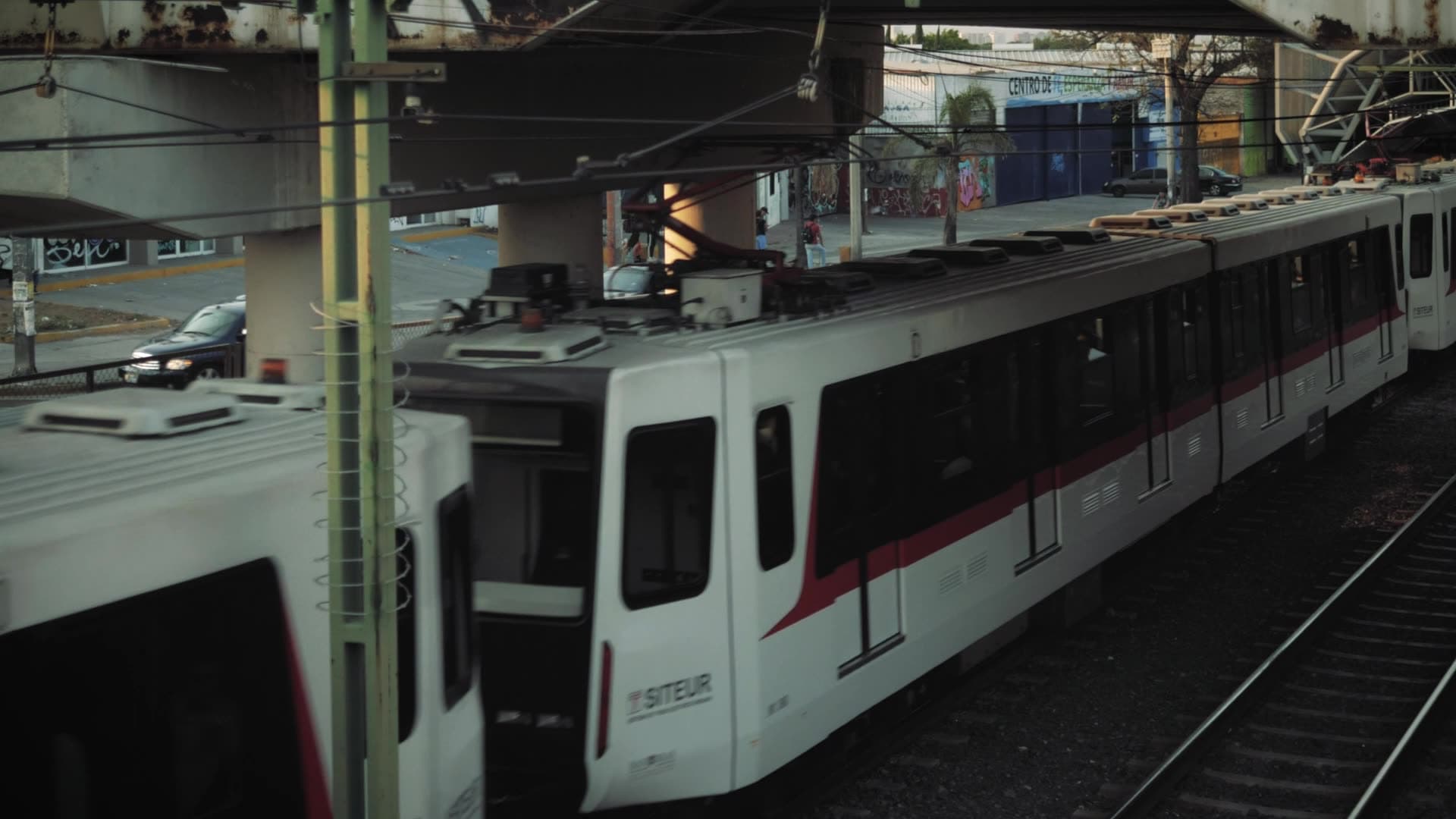 Commuter train waiting at an elevated station