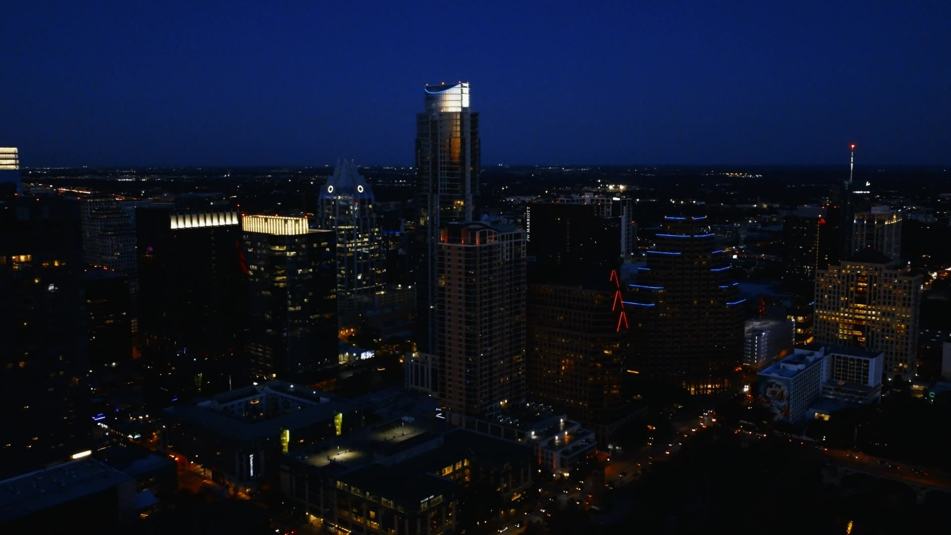 City skyline under a deep blue evening sky